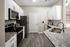 Modern kitchen with sleek granite countertops, stainless steel appliances, and elegant white cabinets, perfect for culinary creativity.