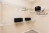 Spacious walk-in closet with sleek wire shelving, elegant storage bins, and ample hanging space, ideal for organized living.