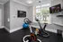 Modern in-apartment gym featuring state-of-the-art indoor cycling machines, bright windows, and an inspiring workout ambiance.