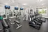 State-of-the-art fitness center with modern cardio machines, weightlifting equipment, and bright windows for an energized workout experience.