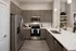 Contemporary kitchen boasting sleek cabinets, stainless steel appliances, and modern design elements with elegant countertops.
