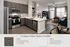 Modern kitchen and living room with slate gray cabinets and inviting open layout, showcasing warm, earthy tones and sleek appliances.