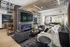 Luxurious modern living room with stylish furniture, sleek fireplace, and open layout perfect for relaxation and entertaining.
