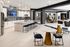 Modern upscale kitchen and lounge area featuring sleek countertops, stylish bar stools, and elegant dining setup with chic decor.