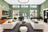 Elegant lounge area with modern decor, two luxurious white sofas, vibrant green accent wall, and expansive windows offering ample natural light, perfect for relaxation and social gatherings.