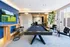 Modern entertainment room with a sleek pool table, large TV, and stylish seating area, perfect for relaxation and leisure.