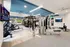 Modern fitness center featuring state-of-the-art equipment, sleek design, and ambient lighting, perfect for a dynamic workout experience.