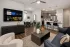 Open kitchen with slate cabinets and living area at Abberly Commons in Charlotte, NC.