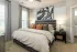 Primary bedroom with plush carpeting at Abberly Commons in Charlotte, NC.