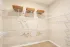 Walk-in closet with built-in shelving at Abberly Commons in Charlotte, NC.