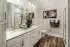 Bathroom with double vanity and walk-in shower at Abberly Commons in Charlotte, NC.