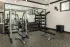Fitness center with free weights and strength equipment at Abberly Commons in Charlotte, NC.