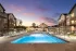 Resort-style pool illuminated at sunset at Abberly Commons in Charlotte, NC.