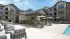 Outdoor courtyard with grilling stations at Abberly Commons in Charlotte, NC.