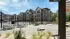 Covered outdoor lounge with fireplace at Abberly Commons in Charlotte, NC.