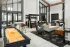 Resident clubhouse with shuffleboard and lounge seating at Abberly Commons in Charlotte, NC.