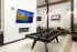 Community game room with pool table at Abberly Commons in Charlotte, NC.