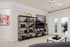 Contemporary living room with elegant bookshelves, artistic decor, and a bright balcony view, perfect for relaxation and entertainment.