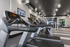 Modern fitness center with state-of-the-art treadmills and sleek design, perfect for an active lifestyle.