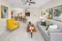 Inviting open-concept living room with modern decor, featuring a comfy grey sofa, vibrant yellow armchair, stylish wooden coffee table, and elegant dining area.