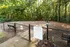 Inviting dog park featuring a fenced area with lush greenery, perfect for pet-friendly gatherings and playtime.