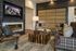 Elegant living area with plush seating, a modern fireplace, and stylish decor creating a cozy and inviting atmosphere.