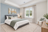 Elegant bedroom featuring a plush bed with a green and white color scheme, natural light streaming through large windows, and tasteful wall art enhancing the serene atmosphere.