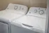 Modern laundry room featuring sleek white washer and dryer, perfect for convenient and efficient home living.
