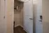 Inviting storage closet with elegant doors and sturdy shelving, perfect for organizing essentials in style.