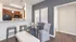 Chic open kitchen and dining area with modern lighting, sleek countertops, and elegant decor.