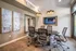 Modern conference room featuring sleek design, contemporary artwork, and comfortable seating.