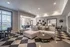 Modern, spacious living area with stylish decor, cozy seating, and abundant natural light.