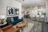 Open-concept living room, dining area, and kitchen with island seating at Abberly Royal Creek in Raleigh, NC.