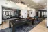 Clubroom with billiards table, foosball table, and lounge seating at Abberly Royal Creek in Raleigh, NC.