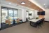Conference room with poker-style game table and entertainment display at Abberly Royal Creek in Raleigh, NC.