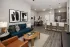 Open-concept living room and kitchen with island seating at Abberly Royal Creek in Raleigh, NC.