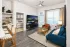 Apartment living room with dining area, kitchen island, and modern furnishings at Abberly Royal Creek in Raleigh, NC.