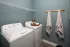 In-home laundry room with washer and dryer at Abberly Royal Creek in Raleigh, NC.