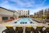 Saltwater pool with in-water lounge chairs and sun deck at Abberly Royal Creek in Raleigh, NC.
