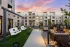Outdoor lounge with fire pit seating and porch swings at Abberly Royal Creek in Raleigh, NC.