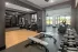 Fitness center with strength training equipment and free weights at Abberly Royal Creek in Raleigh, NC.