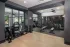 Modern fitness center with free weights and strength training machines at Abberly Royal Creek in Raleigh, NC.