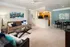Inviting living space showcasing a chic seating area, modern kitchen, and stylish dining nook with artistic decor.