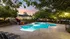 Inviting outdoor pool area surrounded by lush greenery and elegant seating, perfect for relaxation and entertaining at sunset.