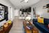 Modern open-plan living area with a sleek kitchen, chic furnishings, and inviting decor.