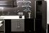 Chic modern kitchen with sleek black and grey cabinets, integrated appliances, and artistic chalkboard design.