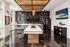 Modern kitchen with a chic industrial design, featuring sleek gray cabinets, contemporary lighting, and a stylish chalkboard wall art.