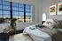 Factory window Bedroom With Tan bedding