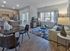 Contemporary open-concept living room with modern kitchen, dining area, and stylish decor.