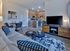 Elegant open-plan living area with a modern kitchen and stylish furnishings.